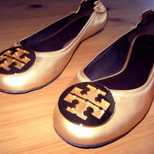 Tory Burch Reva leather ballet flats in gold.
